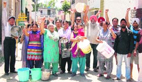 Residents of Major Colony, Jalandhar, protest due to lack of water supply for a week, on Saturday.