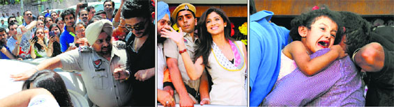 (Left to right): Fans jostle to catch a glimpse of the diva; Bollywood actor Shilpa Shetty waves to the crowd; and a restless child cries in Ludhiana on Saturday.