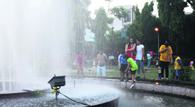 Beating the heat: Children enjoy themselves in a park