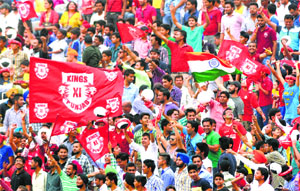 Spectators enjoy an IPL match between Kings XI Punjab and Delhi Daredevils at the PCA Stadium in Phase IX, Mohali, on Sunday. 