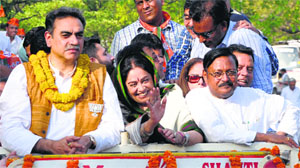 Kirron Kher along with BJP city unit in-charge Sanjay Tandon and party leader Satya Pal Jain during a victory rally in Chandigarh.