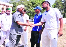 Sports Minister Dinesh Aggrawal meets players during the inauguration of the 32nd All India Uttarakhand Gold Cup Cricket Tournament in Dehradun on Sunday