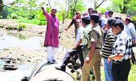 Uttarakhand Forest Minister Dinesh Aggarwal inspects the drainage work in Clementown area in Dehradun on Saturday
