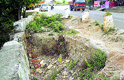 The damaged portion of the National Highway-154 near Nurpur