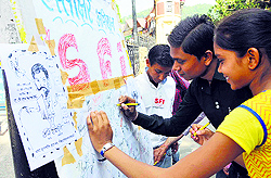 Putting down Resentment: Students participate in a signature campaign, organised by the SFI, against ADN Bajpai, Vice-Chancellor of Himachal Pradesh University, in Shimla on Saturday