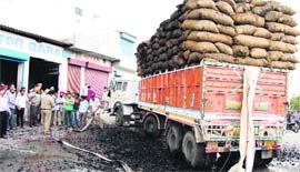 A truck overloaded with dry coal caught fire after coming in contact with overhead electric wires in Jalandhar on Sunday.