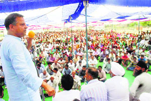 MLA from Bishnah Ashwani Sharma addresses a public rally at Arnia on Sunday. 