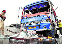 A policeman inspects the accident site at the elevated road in Ludhiana