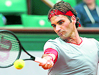 Roger Federer returns to Lukas Lacko during their first round match