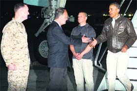 US President Barack Obama greets US Ambassador to Afghanistan James Cunningham after disembarking from Air Force One upon his arrival at Bagram Air Field in Kabul on Sunday. He visited the US troops prior to the Memorial Day holiday.