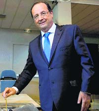 French President Francois Hollande casts his ballot in Tulle, central France.