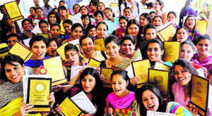 Students pose with their trophies during the prize distribution function at the Government College of Education, Sector 20, Chandigarh, on Monday.