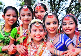Girls pose for a photograph before their performance at Natya Mahotsav in Dehradun on Monday.