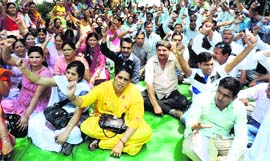 Government teachers protest outside an examination centre at Jagadhri in Yamunanagar district on Monday.