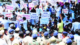 Villagers protest against the Gurgaon MC chief near Nathupur village on Monday.