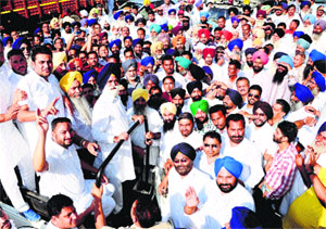 Sarwan Singh Phillaur and his son Damanvir with their supporters in Jalandhar on Monday. 