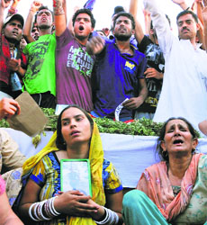 Family members of Naik Darshan Lal protest against Army officials for not providing the military honour to the deceased in Jammu on Monday.