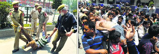 Policemen detain an employee of the Public Health Engineering department; and (right) people carry an injured employee following a lathi-charge by the police during a protest march in Srinagar on Monday.