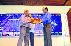 Director, NIT, Rajat Gupta felicitates a guest during the technical festival at the National Institute of Technology in Srinagar on Monday.