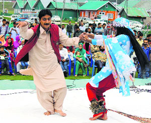 Kashmiri folk artistes perform during a tourism promotion event organised by the J&K Academy of Art and Culture in Gulmarg.