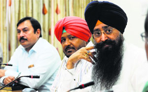 PWD Minister Sharanjit Singh Dhillon (extreme right) briefs mediapersons in Ludhiana on Monday. 