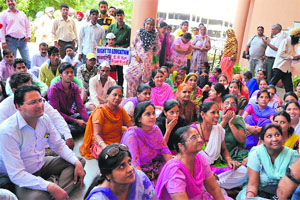 Rashtra Dharma activists and parents protest outside the Deputy Commissioner's office in Ludhiana on Monday.
