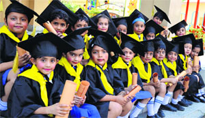Tiny tots in a jubilant mood after receiving their degrees at GMT Public School in Ludhiana.