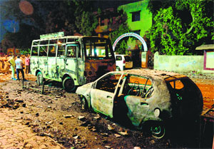 Burnt vehicles at the site of a clash between two groups in the Gomptipur area of Ahmedabad on Sunday night.