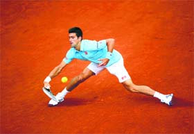 Novak Djokovic beat Joao Sousa 6-1 6-2 6-4 in the first round of the French Open in Paris on Monday