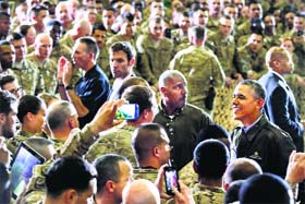 President Barack Obama greets troops at Bagram Air Field, north of Kabul, during an unannounced visit on Sunday