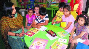Author and editor Himanjali Sankar shares instances from her book with children at One-Up in Amritsar. 