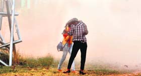 Young girls brave a dust storm in Sector 10, Chandigarh, on Tuesday.