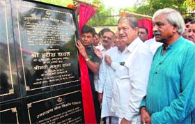 Chief Minister Harish Rawat lays the foundation stone of various development projects planned across the state, at a function in Dehradun on Tuesday