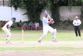 ELEGANT SHOT: A batsman plays a shot in a match in the All India Uttarakhand Gold Cup Cricket Tournament played at the Rangers College ground in Dehradun on Tuesday