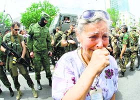 A woman cries as pro-Russia militants parade to mark Donetsk and Lugansk regions' independence from Ukraine in Donetsk on May 25