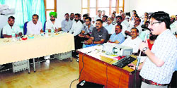 Excise and Taxation officers and traders during a workshop on e-filing of tax returns in Una on Tuesday. 