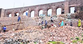 The restoration work of the Bahu Fort wall in full swing in Jammu.