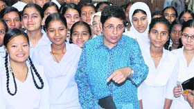 Former IPS officer Kiran Bedi interacts with girl students during the launch of a special scholarship scheme in Jammu on Tuesday.