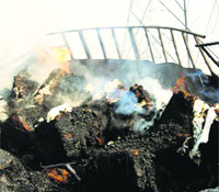 The charred remains of a truck that caught fire near Sahnewal.