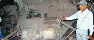 A man shows the exploded boiler.