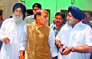 Chief Minister PS Badal and Deputy CM Sukhbir Badal with Union Home Minister Rajnath Singh in New Delhi on Tuesday.