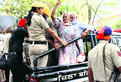 Members of the BKU being rounded up