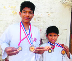 Aditya Singh (left) of Mount Carmel School, Sector 47, and Anupam Singh of Saupins School, Sector 32, show their medals. 