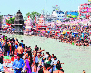 Devotees take a dip in the Ganga on the occasion of Amavasya at Har-ki-Pauri in Haridwar on Wednesday.