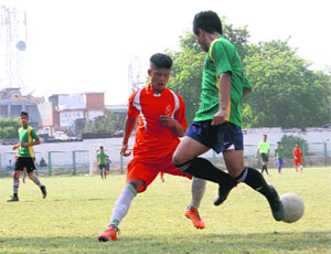Players vie for the ball in a match in the Dehradun District Football League played at Pavilion Ground in Dehradun on Wednesday.