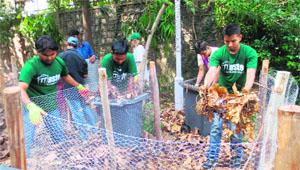 Volunteers of Waste Warriors participate in a workshop on making compost from waste in Dehradun on Tuesday.