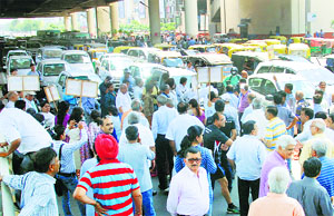 Residents of Shusant Loke phase-1 block traffic on the MG road to protest against a developer company for not providing basic amenities in Gurgaon on Wednesday.