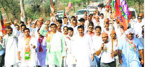 BJP Kisan Morcha workers take out a padyatra at Kosli town in Rewari on Wednesday. 