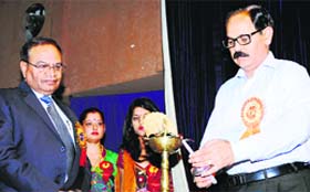 Vice-Chancellor KK Katoch lights a lamp to inaugurate the two-day national seminar on organic agriculture at CSK HP Agriculture University in Palampur on Wednesday