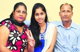 Palak Sain, non-medical topper, with her parents